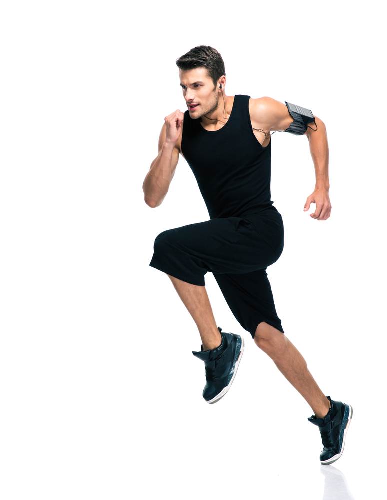 Full length portrait of a fitness man running isolated on a white background Full length portrait of a fitness man running isolated on a white background